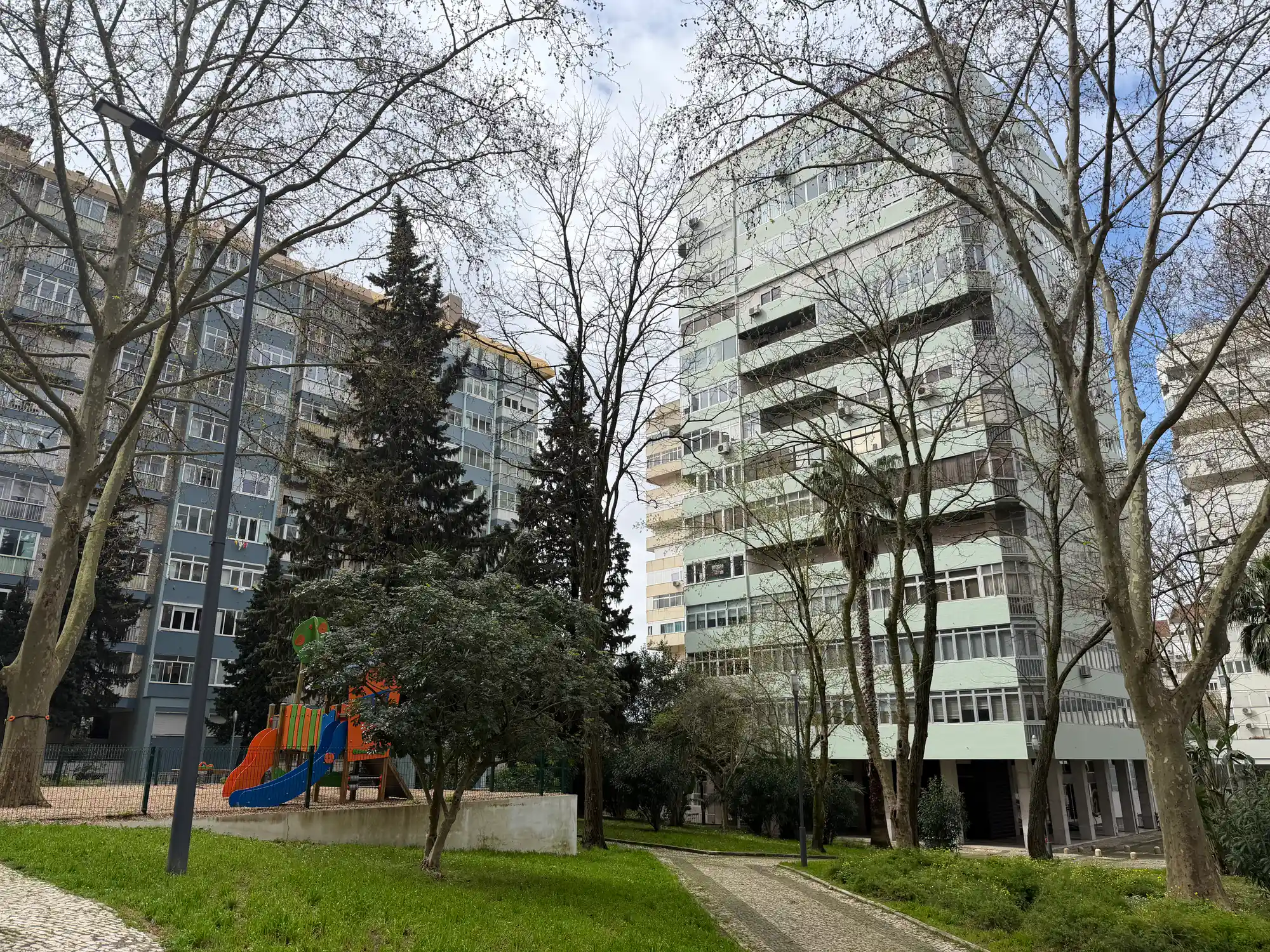 São Domingos de Benfica Lisbon residential area with apartment buildings, playground, trees, and green space
